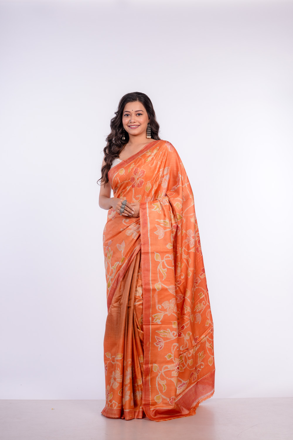 Vibrant Orange Floral Batik on HandwovenTussar Saree