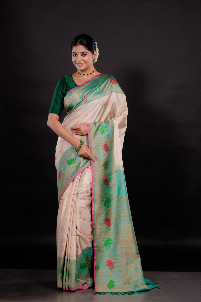 Green And Pristine Off-White Adorned With Exquisite Floral Motifs Handwoven Gadwal Saree